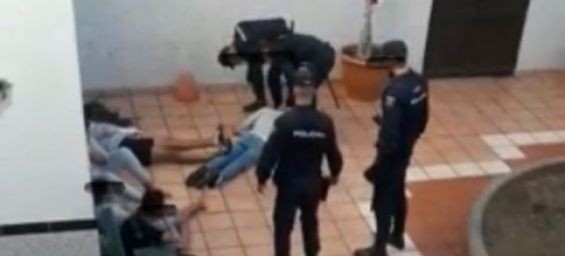 A minor migrant on the ground at a minors reception center following a violent police intervention. / DR