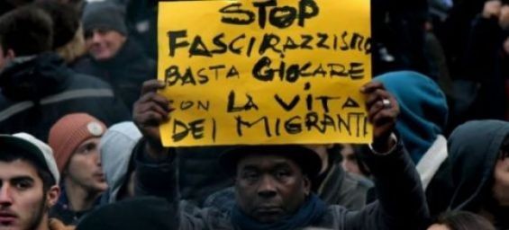 A sign stating "Stop Fascism and Racism, stop playing with the lives of migrants" during a protest in Macerata, Italy, on February 10, 2018. / Ph. Tiziana Fabi - AFP