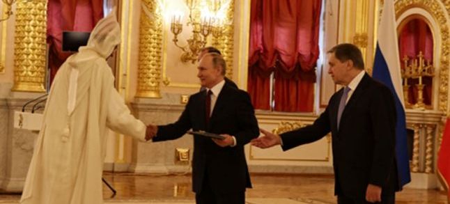 Russian President Vladimir Putin and Morocco's ambassador to Moscow Lotfi Bouchaara. / DR