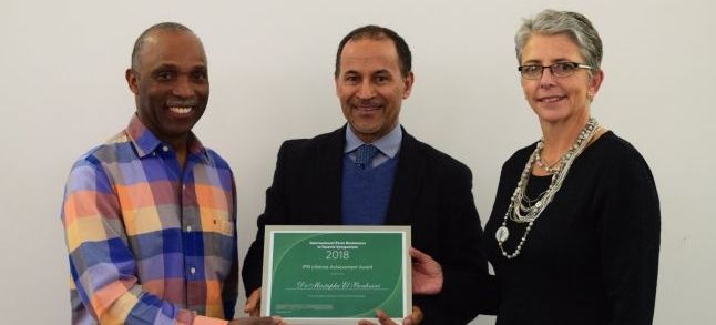 Mustapha El Bouhssini, a Moroccan scientist posing with his Lifetime Achievement Award./Ph. DR