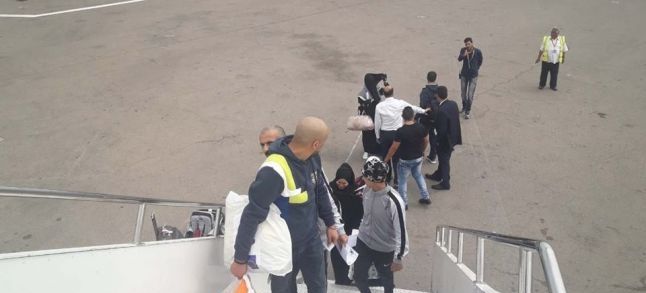 Moroccan illegal migrants getting on a plane at the Mitiga Airport in Libya, heading to the Kingdom./Ph. Facebook- the Illegal Immigration Agency