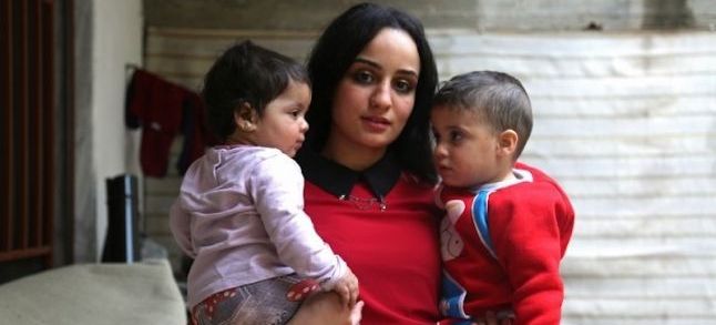 Islam Maytat with her children after escaping ISIS./Ph. DR