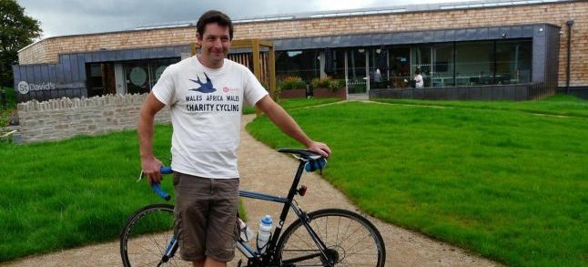 Ed Beverly-Jones standing next to his bike./Ph. South Wales Argus