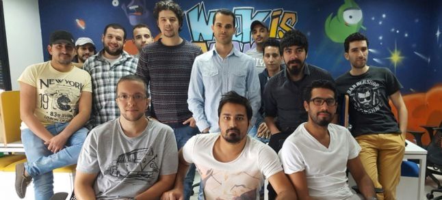 Hatim Bensaid (third person from right to left ) posing with the Funsoft team who designed Rangi./Ph. gamesauce