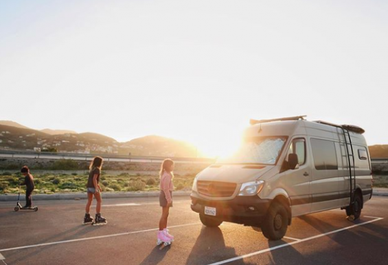 Marlene and Dan's kids playing next to their van while stranded in Morocco. / Mali Mish Intagram