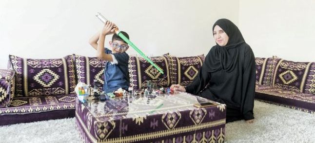 Samira Al Zaher and her son./Ph. The National 