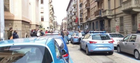 Italy : A policeman enters the Moroccan consulate in Turin with a gun in his hand