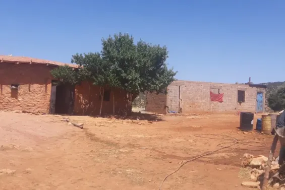 Just meters from the power grid, families near Bouydmouma still live in darkness