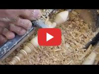 A Moroccan carpenter making a wooden honey dipper using his feet